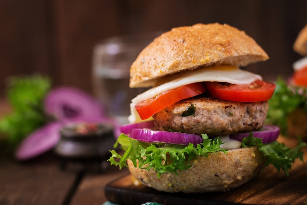 Hamburger (Sandwich) with chicken burger, lettuce, tomato, fried egg