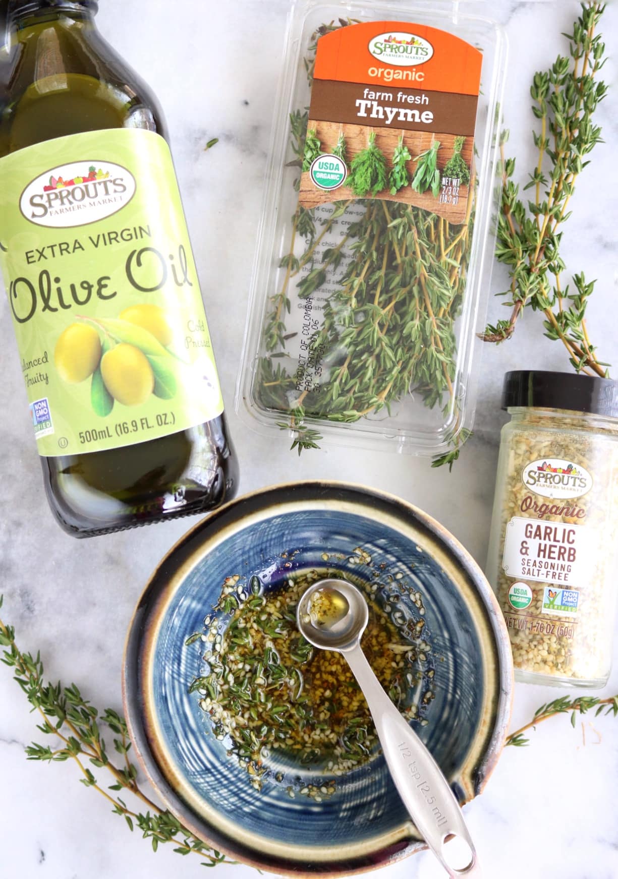 Olive oil, thyme, and garlic & herb seasoning mixture for tenderloin and vegetables