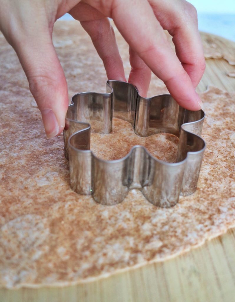 Creating tortilla chips using a metal, shamrock-shaped cookie cutter
