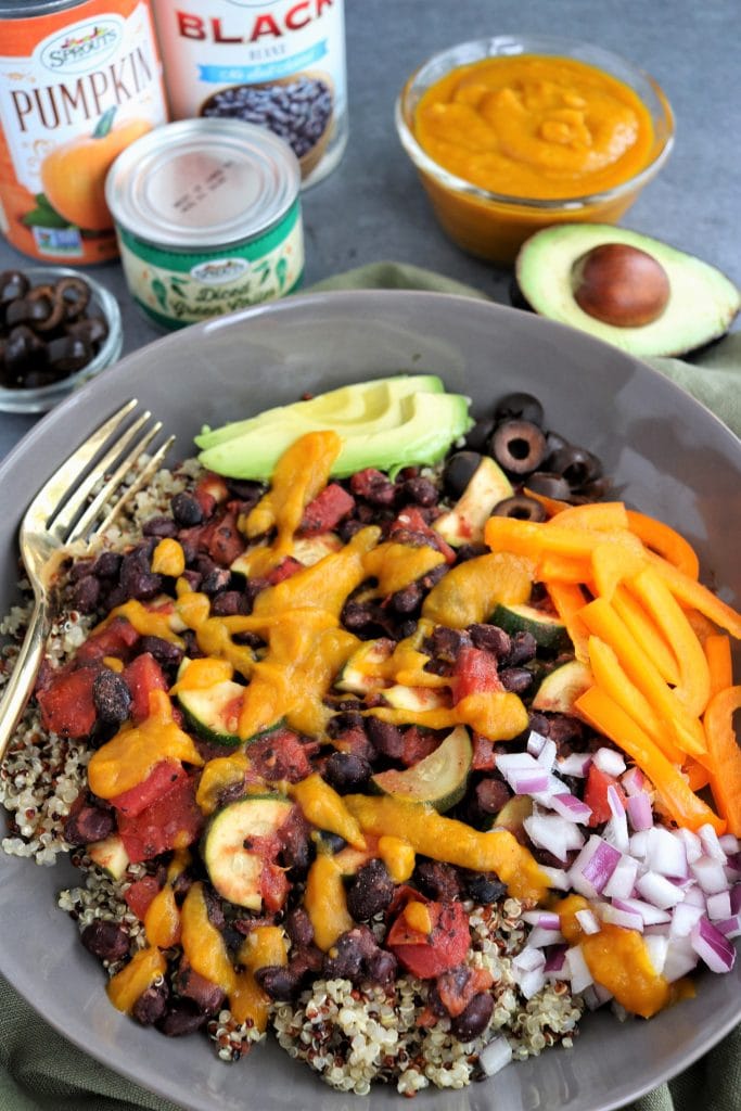 Black Bean Bowl with Pumpkin-Chile Sauce and sliced avocado on side