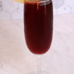 champagne glass filled with tart cherry juice mocktail