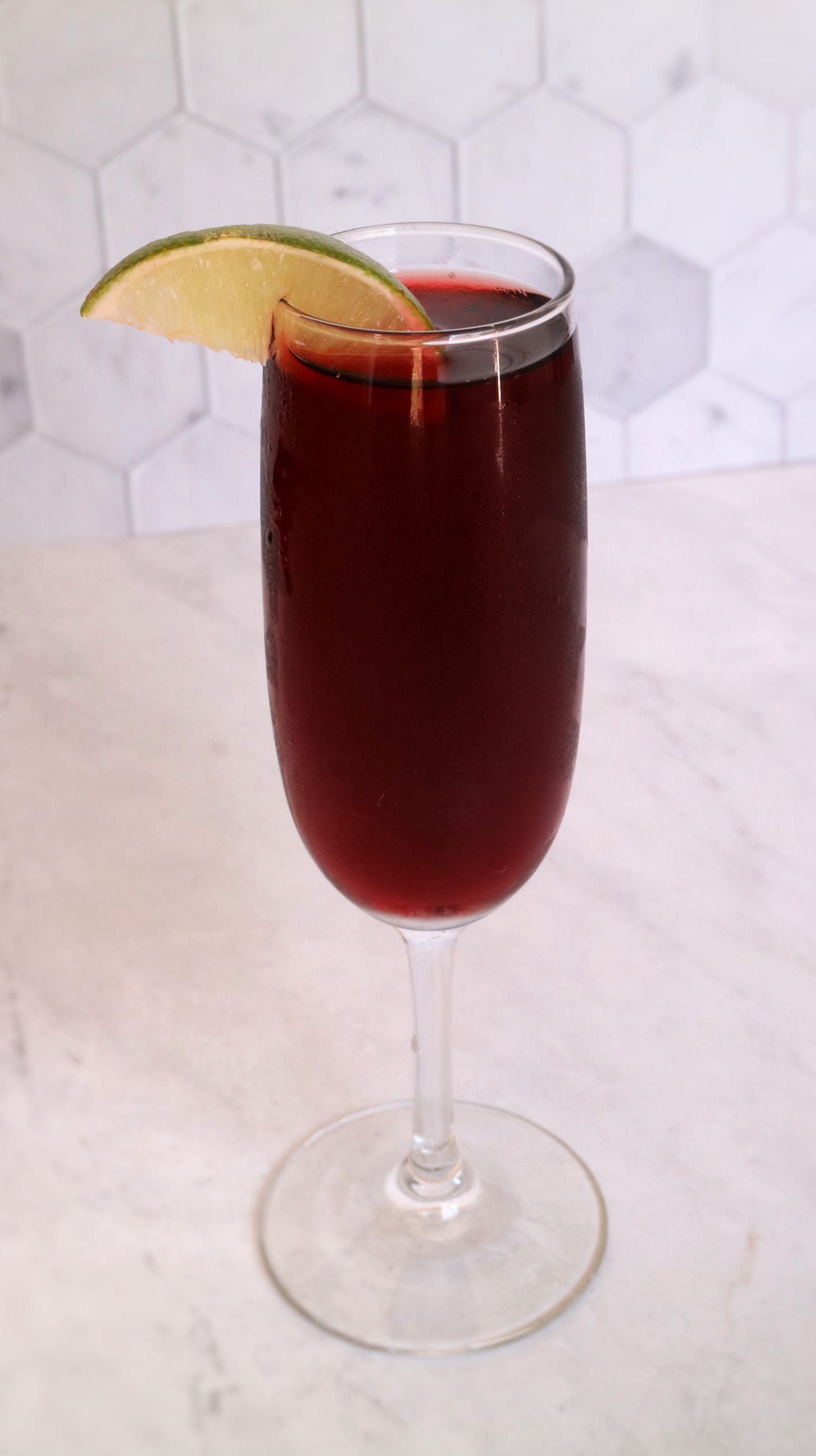 champagne glass filled with tart cherry juice mocktail